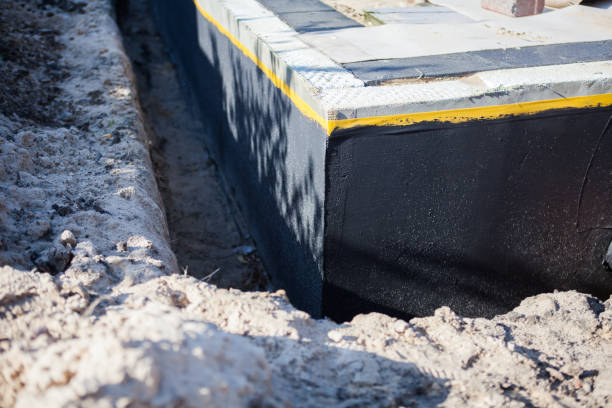 Professional Basement Waterproofing technician working in Xenia, OH